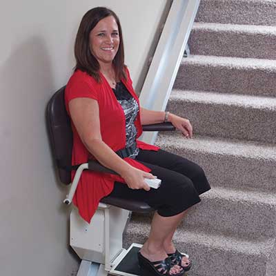 Image of a Woman on a stairlift