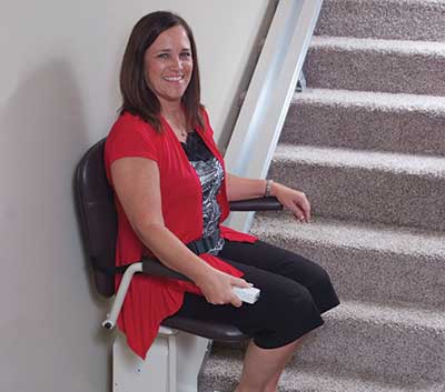 Woman on a stairlift