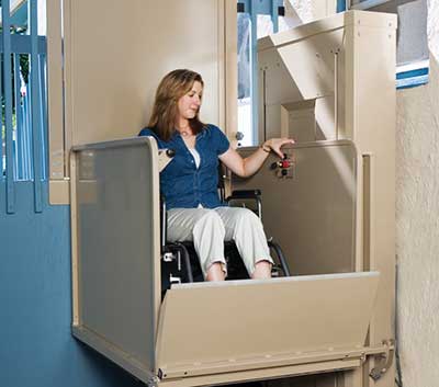 Woman in a wheelchair lift
