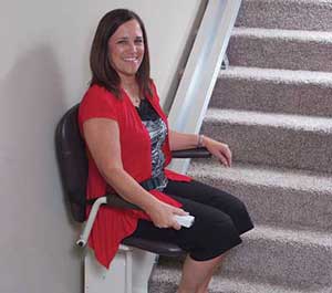 Woman using Stairlift